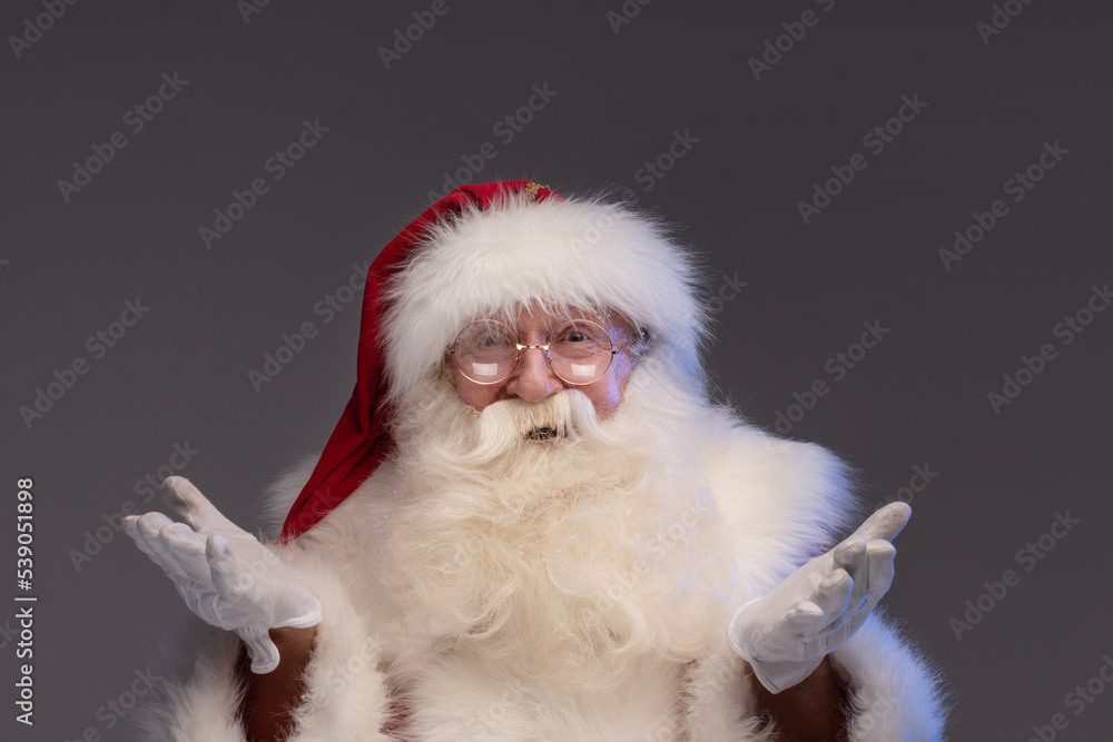Merry Christmas and Happy New Year! Portrait of jolly Santa Claus with white beard looking at the camera, smiling. Xmas sale Merry Christmas and Happy New Year! Portrait of jolly Santa Claus with white beard looking at the camera, smiling. Xmas sale
