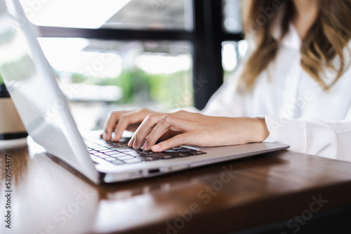Business Woman hands typing on computer keyboard. Business Woman working on laptop.