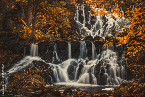 Beautiful waterfall in autumn forest in Jonkoping  Sweden. Long exposure.