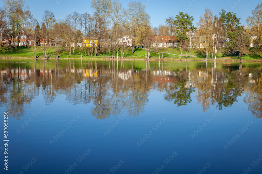 Peaceful city park and church on the lake Druskonis reflection, lithuania Peaceful city park and church on the lake Druskonis reflection, lithuania