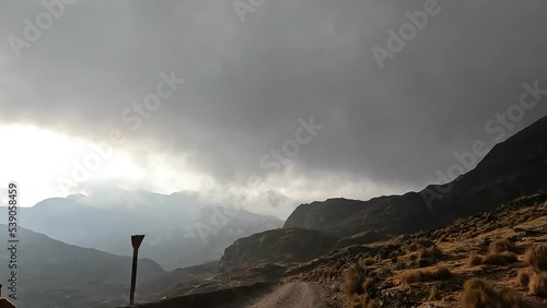 Road trip in the Peruvian Andes. High altitude mountains trip by car crossing the Andean country side. 