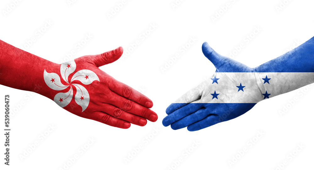 Obraz premium Handshake between Honduras and Hong Kong flags painted on hands, isolated transparent image.