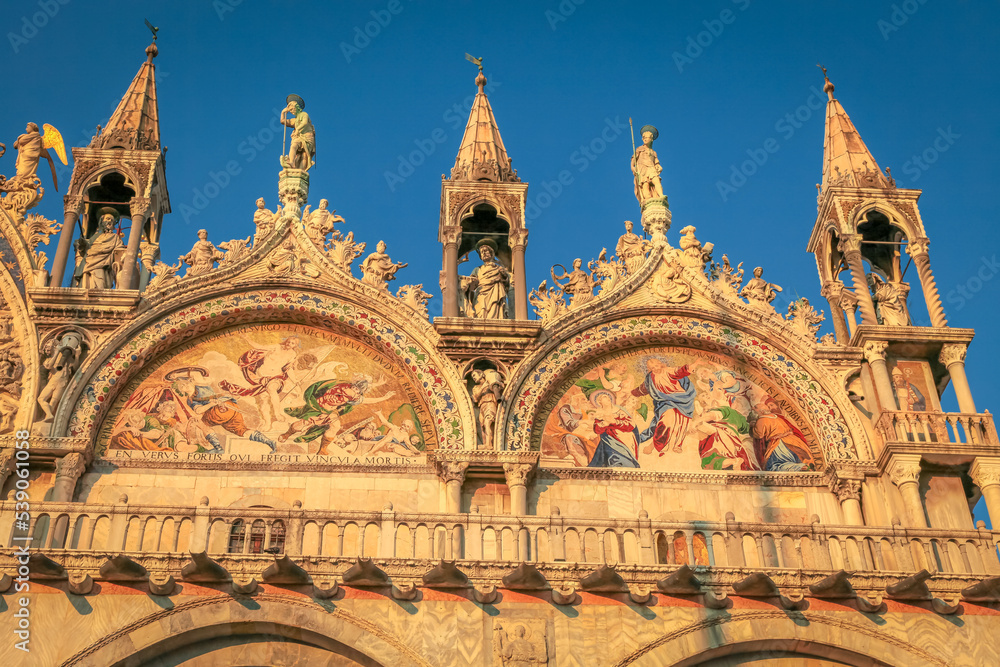 St Mark Basilica facade detail, with lion and angels, Venice, Italy