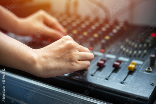 close up hands tuning of sound mixer