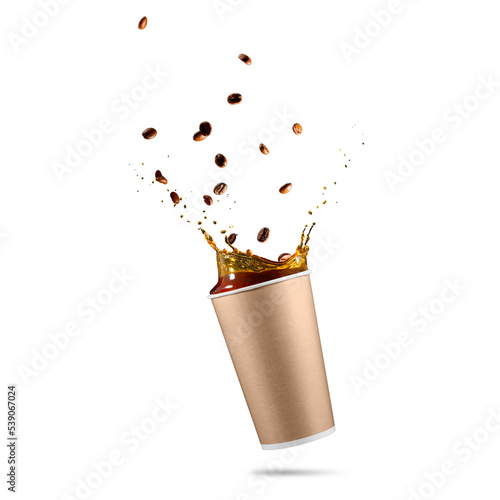 takeaway paper cup with splashing coffee. falling disposable paper cup with coffee splash. splashes of coffee in a paper cupt photo