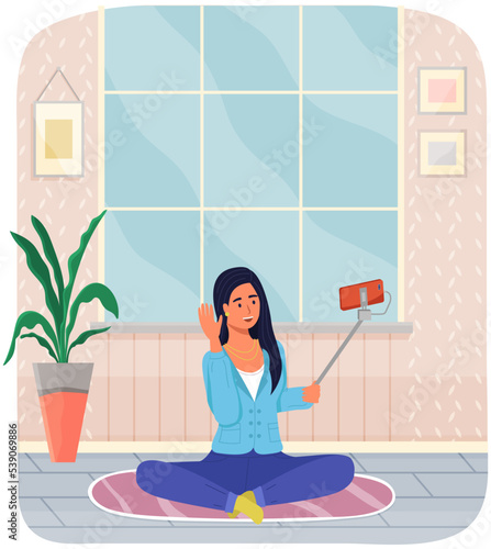 Young girl taking selfie or recording video. Beautiful female model, internet influencer with smartphone on monopod. Blogger, vlogger shooting video. Woman holding tphone on selfie stick at home