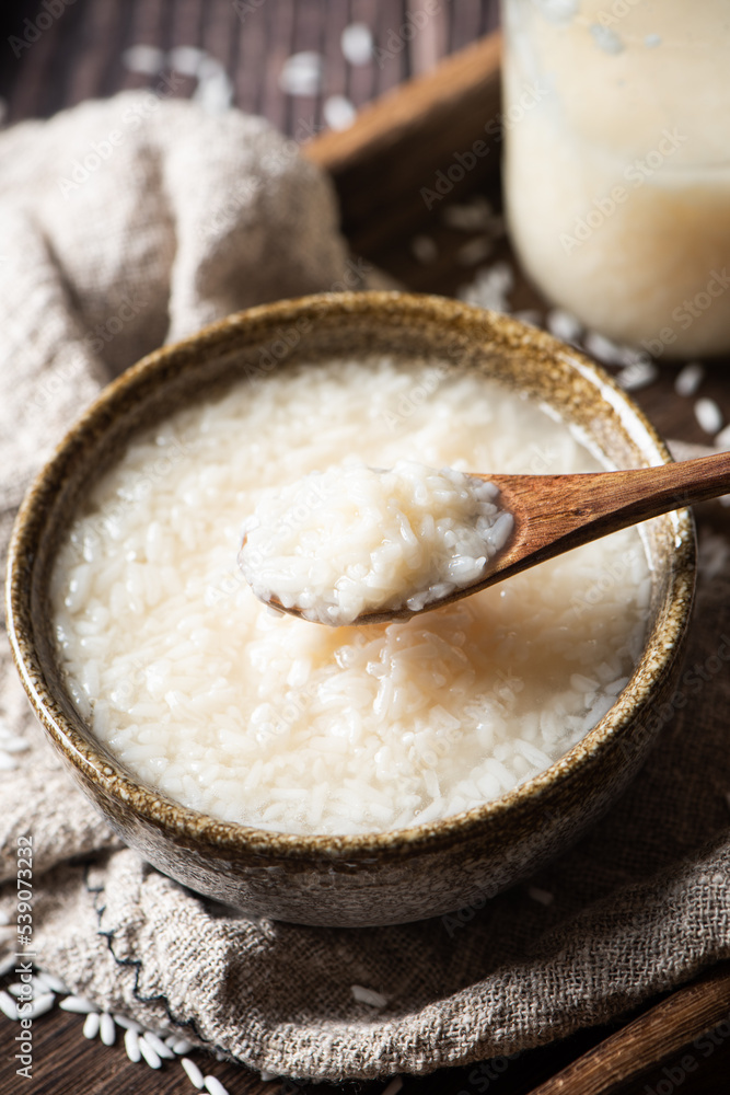 Delicious fermented glutinous rice wine on table Delicious fermented glutinous rice wine on table
