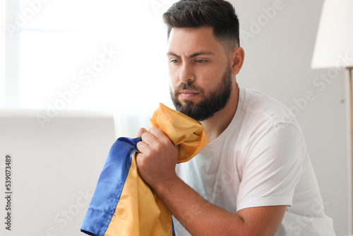 Young man with flag of Ukra...