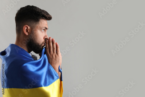 Young man with flag of Ukra...