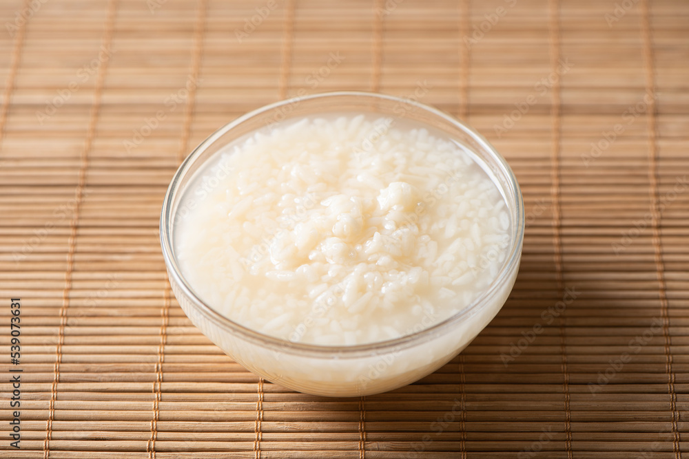 Delicious fermented glutinous rice wine on table Delicious fermented glutinous rice wine on table