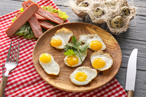 Quail eggs and sausage brea...