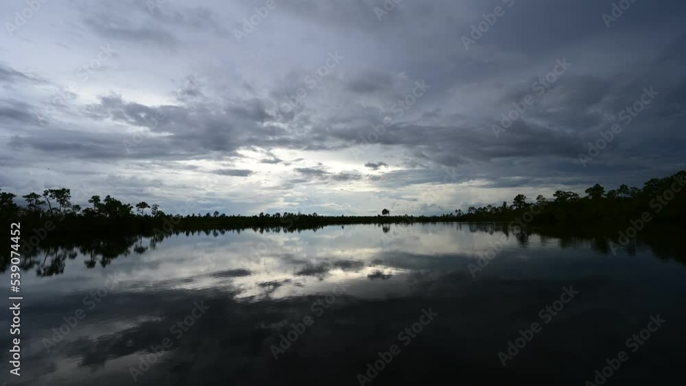 Timelapse of twilight cloudscape over Pine Glades Lake in Everglades National Park, Florida 4K. Timelapse of twilight cloudscape over Pine Glades Lake in Everglades National Park, Florida 4K.
