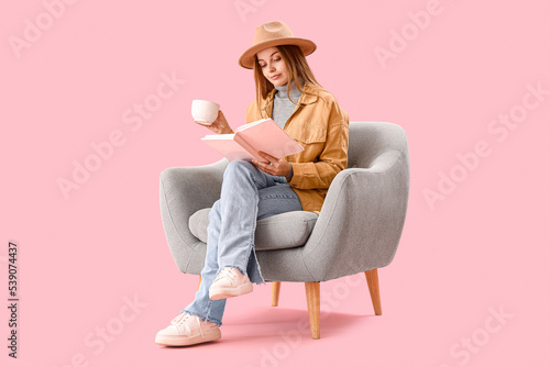 Young woman with cup of hot...