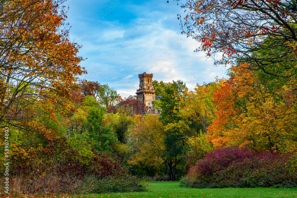 Autumn landscape, tower of the old castle in the city park