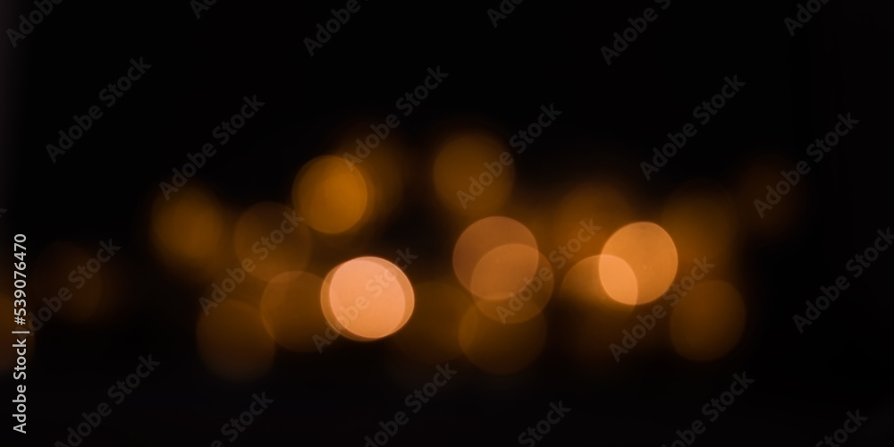 Glowing abstract background, Warm  lights on a black background