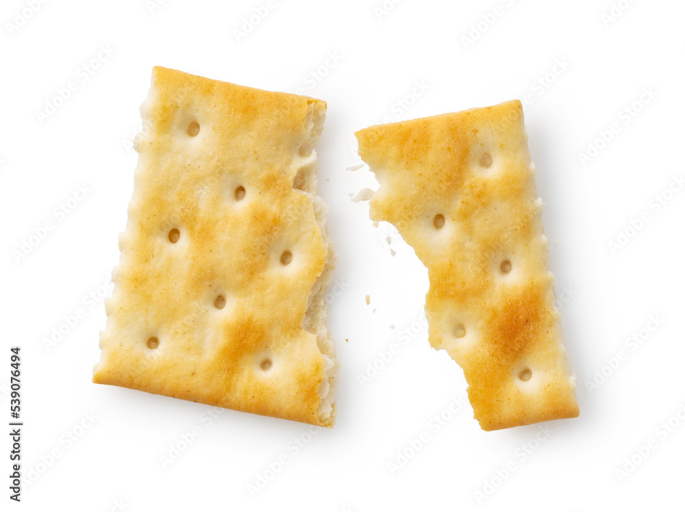 Broken crackers placed on a white background.
