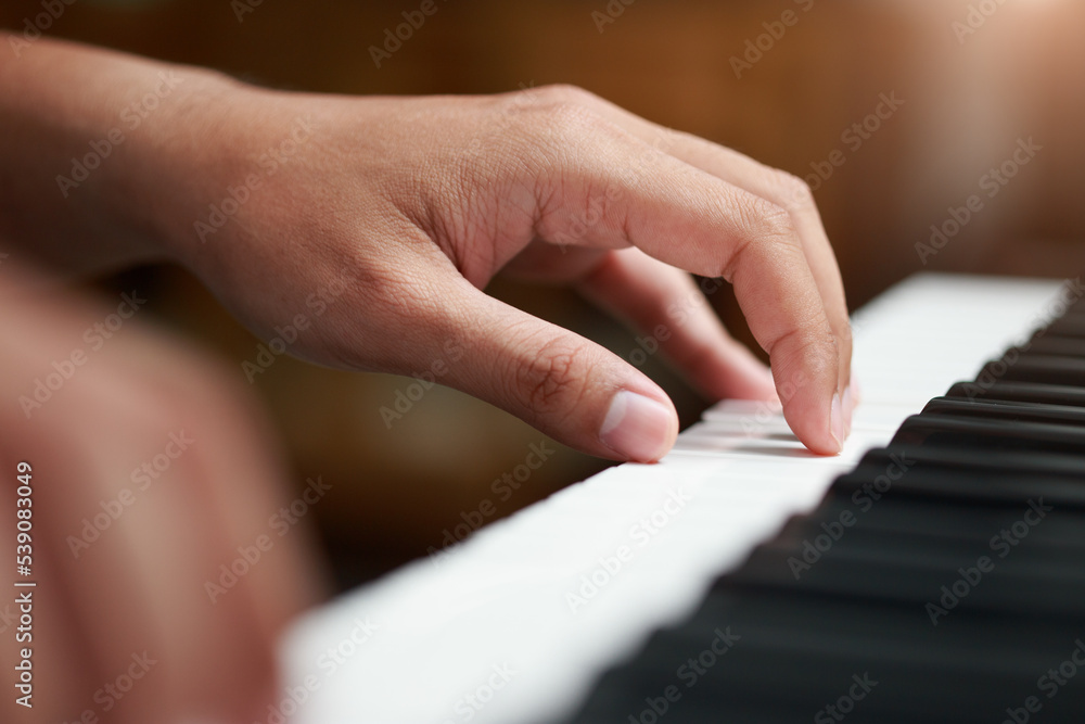 Fototapeta premium Close-up of male hands playing keyboard