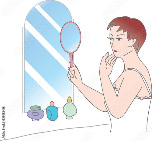 手鏡で肌を気にする女性
