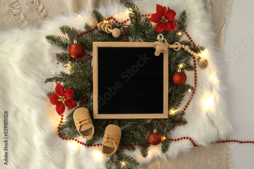 Letter board Baby Announcement . Baby Clothing Mock Up . Space for design . Pregnancy announcement background with blurred . Selective focus photo