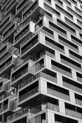 Abstract of modern architecture, walls made of concrete and glass balconies. Architecture details geometric abstract