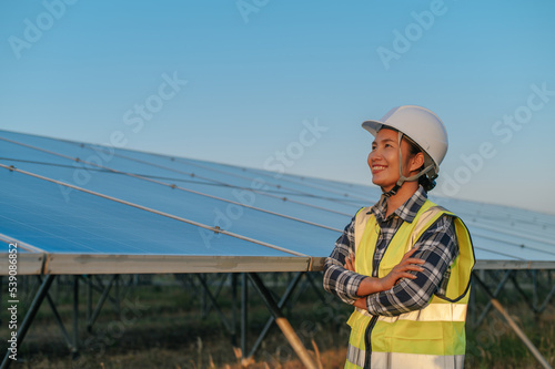 Portrait Female Electrical engineer at solar panel station.