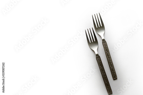 Vintage engraving silverware fork set of two placed side by side isolated on white background