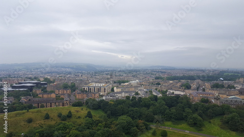 A sprawling landscape view of Edinburgh city from popular Scottish walkway of Arthur's Seat in Scotland © Adam Constanza