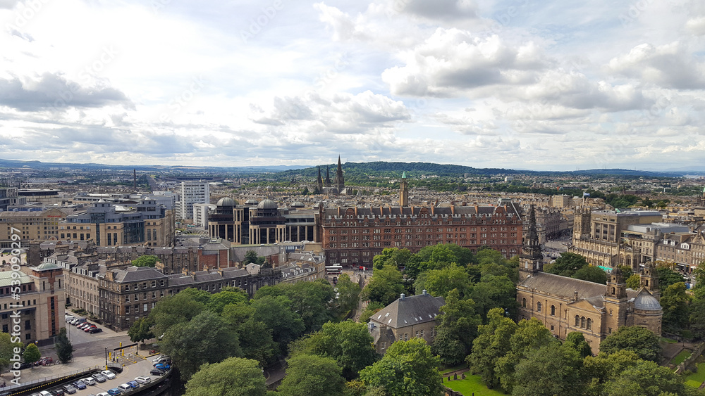 Panoramic landscape view of Edinburgh city with beautiful Georgian style architecture nestled amongst the green trees in Scotland Panoramic landscape view of Edinburgh city with beautiful Georgian style architecture nestled amongst the green trees in Scotland