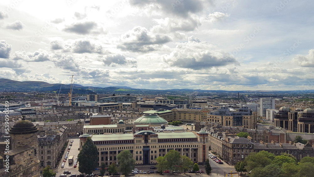 Stunning panoramic view of sprawling Edinburgh city landscape with Georgian architecture houses, buildings and businesses in Scotland