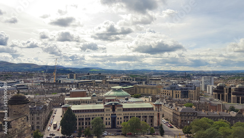 Stunning panoramic view of sprawling Edinburgh city landscape with Georgian architecture houses, buildings and businesses in Scotland © Adam Constanza