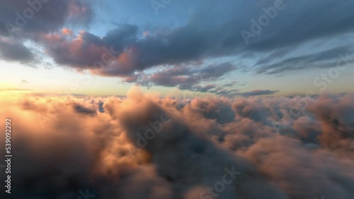 Infinite Fly Above the Cinematic Dusk Clouds Sunset Background Seamless Loop v03 photo