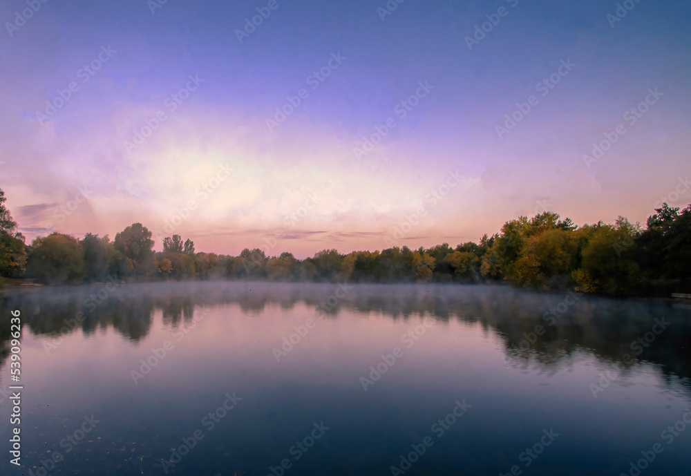 Early morning mist over a lake in Needham Market, Suffolk, UK