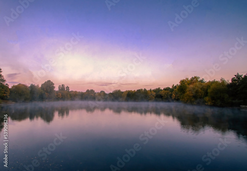 Early morning mist over a lake in Needham Market, Suffolk, UK © Rob