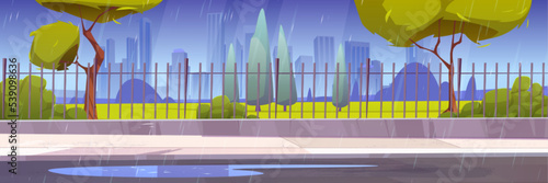 City street at rain, cityscape at rainy weather, urban skyline with skyscrapers, green wet trees, road with puddles along metal fence under strong shower, downtown district Cartoon vector illustration