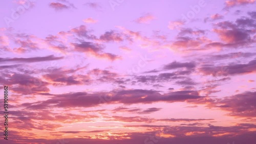 Beautiful Sunset Sun Cirrus Clouds in Colorful Sky, Time Lapse, Slow Motion. Lilac Pink Orange Colored Sky with Clouds and Sun at Sunset. Multicolored Evening Sunset, Timelapse.