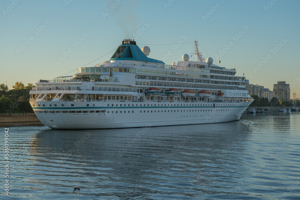 Phoenix cruiseship or cruise ship liner Amera in port of Montreal, Canada on sunny day on St. Lawrence River for Indian summer East Coast cruising with downtown skyline and terminal Phoenix cruiseship or cruise ship liner Amera in port of Montreal, Canada on sunny day on St. Lawrence River for Indian summer East Coast cruising with downtown skyline and terminal