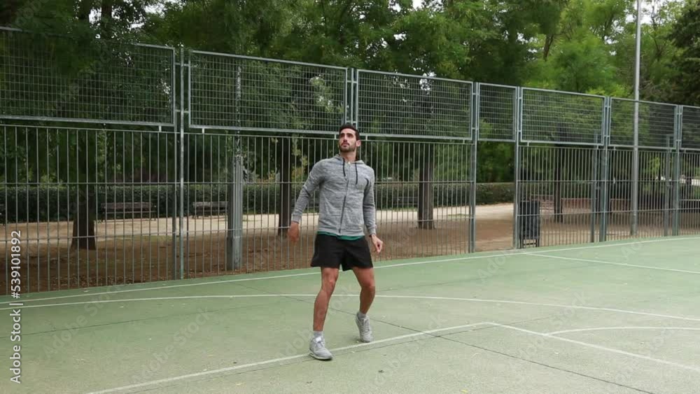 video of a man throwing a ball on an outdoor basketball court video of a man throwing a ball on an outdoor basketball court