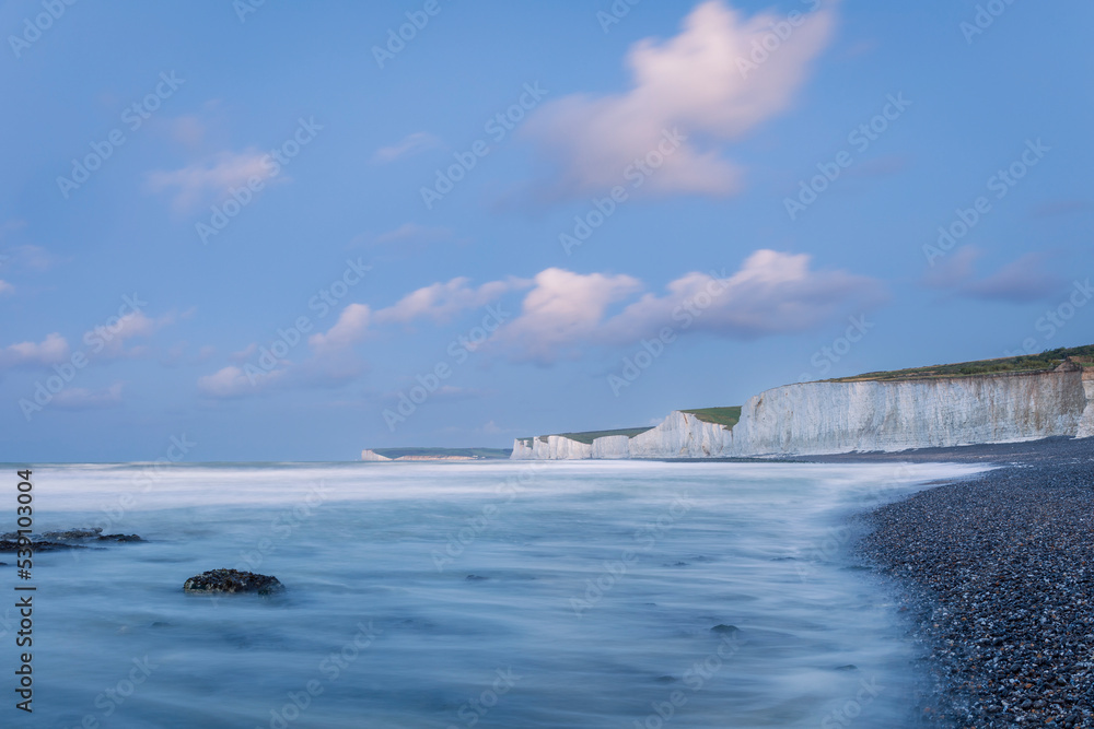 Perilous dawn low tide beach walk from Birling Gap to Beachy Head lighthouse east Sussex coast south east England UK Perilous dawn low tide beach walk from Birling Gap to Beachy Head lighthouse east Sussex coast south east England UK