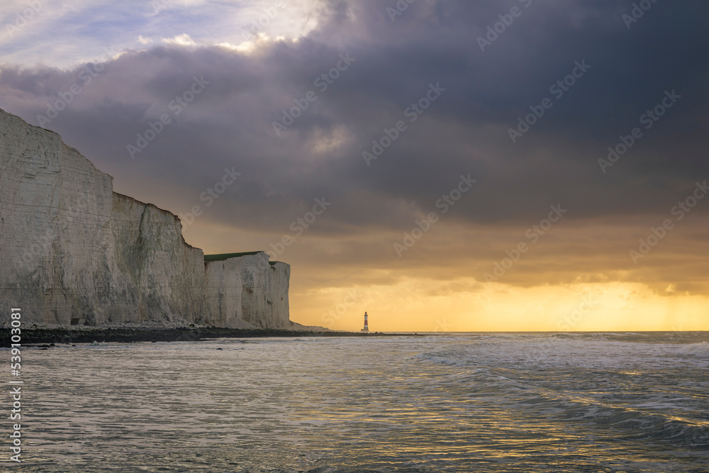 Perilous dawn low tide beach walk from Birling Gap to Beachy Head lighthouse east Sussex coast south east England UK