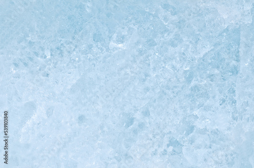 Ice texture crystal, blue tones background. Textured cold frosty surface of ice. © Dmitry Strizhakov