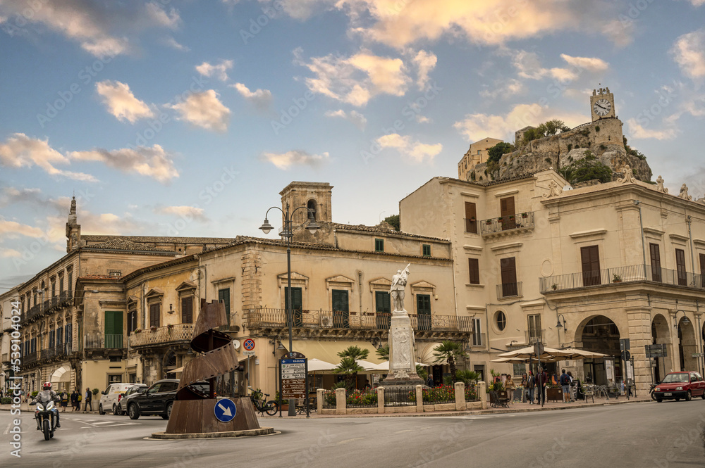 Beautiful square in Modica with the castle in background at sunset