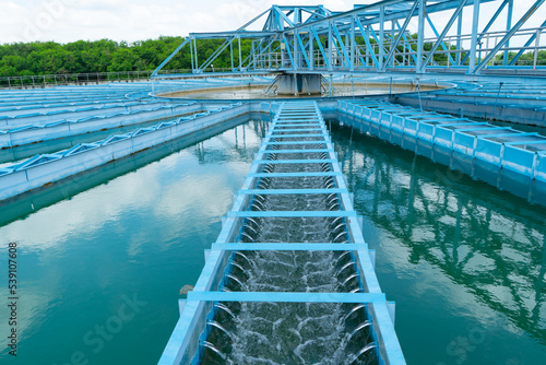 Water treatment,the process of making raw water to clean by putting chemicals in the machines,processing of the solid contact clarifier sediment tank.Wastewater Treatment Plant with steel structure. photo