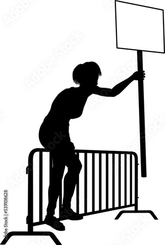 Protestor or demonstrator at a demonstration march, picket line or strike protest rally in silhouette. Holding up a banner or picket sign board placard.