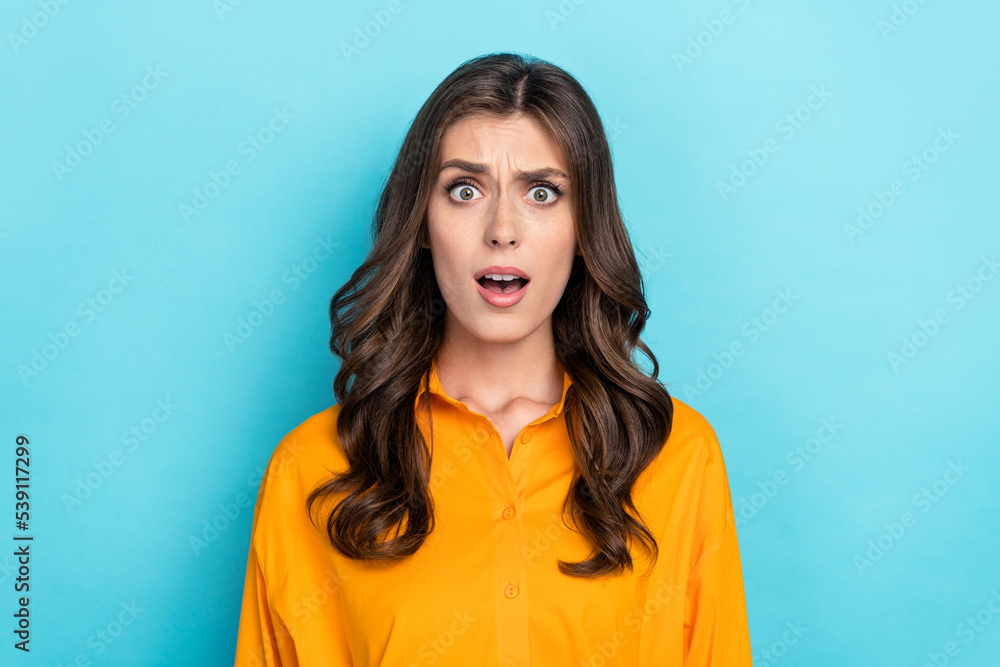 Photo portrait of lovely young girl indignant offended dressed stylish yellow smart casual garment isolated on blue color background Photo portrait of lovely young girl indignant offended dressed stylish yellow smart casual garment isolated on blue color background