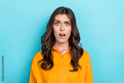 Photo portrait of lovely young girl indignant offended dressed stylish yellow smart casual garment isolated on blue color background