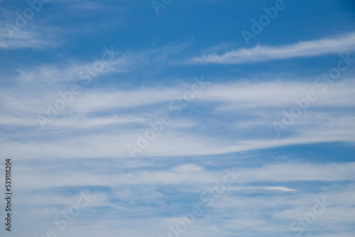 Blue sky cirrus clouds.
