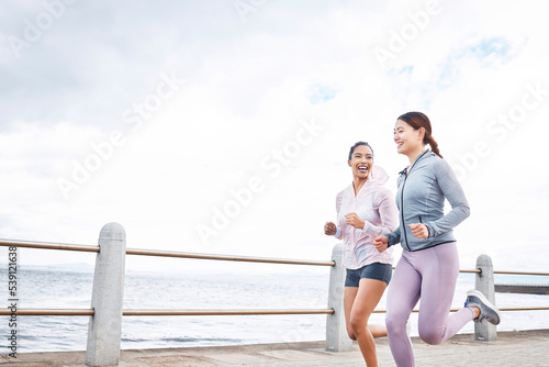 Fotografie Running, fitness and women friends by ocean for outdoor wellness, accountability or workout motivation on sky mock up marketing or advertising