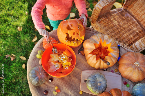 Top view picture of carved pumpking on the table photo