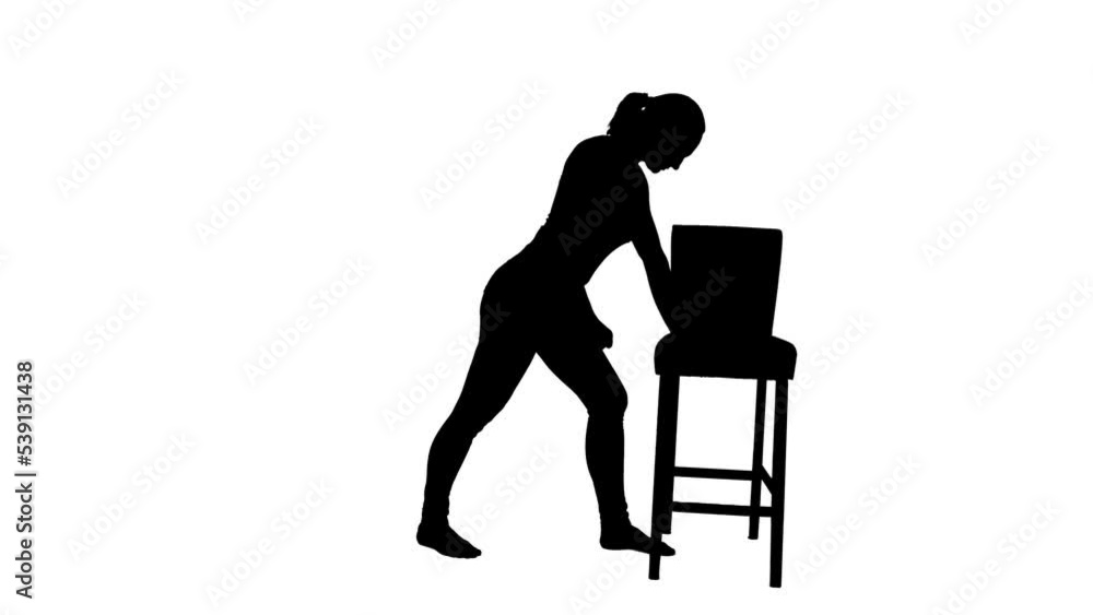 Black silhouette of woman doing exercise pulling arm back on white background. Female athlete is engaged in orthopedic rehabilitation or physiotherapy for pain or injury to muscles, joints. Black silhouette of woman doing exercise pulling arm back on white background. Female athlete is engaged in orthopedic rehabilitation or physiotherapy for pain or injury to muscles, joints.