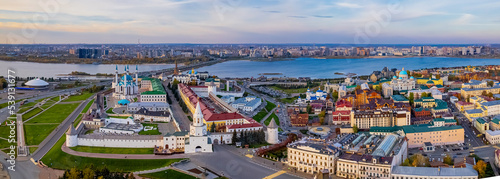 A panoramic view of the Kazan Kremlin with the Qul Sharif Mosque, Preobrazhensky Cathedral and Suyumbike Tower. Spasskaya Tower - the main entrance to the Kremlin. Cityscape with the Kazanka River.